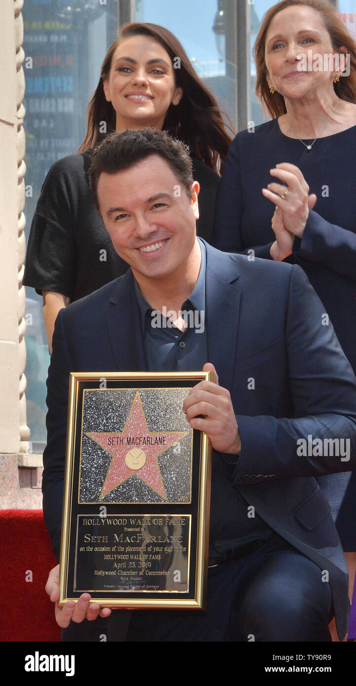American actor, animator, filmmaker, comedian, and singer Seth MacFarlane holds a replica plaque during an unveiling ceremony honoring him with the 2,661st star on the Hollywood Walk of fame in Los Angeles on April 23, 2019. Working primarily in animation and comedy, as well as live-action and other genres, MacFarlane is the creator of the TV series Family Guy and The Orville, and co-creator of the TV series American Dad! and The Cleveland Show. Looking on is Mila Kunis (L) and Ann Druyan.  Photo by Jim Ruymen/UPI Stock Photo