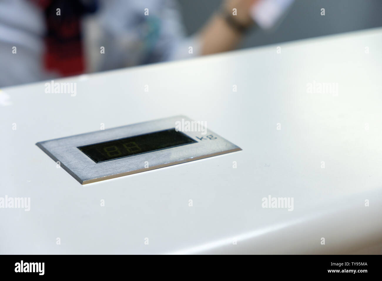 Digital bar weight scale on counter bar in check-in airport Stock Photo