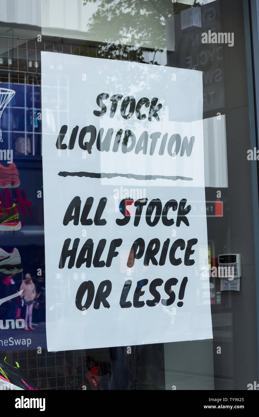 Stock liquidation sign in the shop window of a sportswear shop on Lord Street, Liverpool. Stock Photo