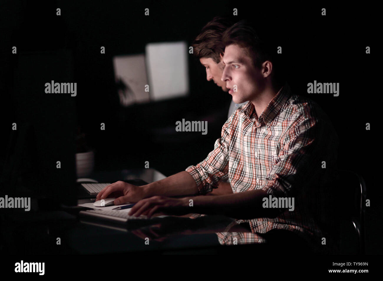 two employees working late Stock Photo