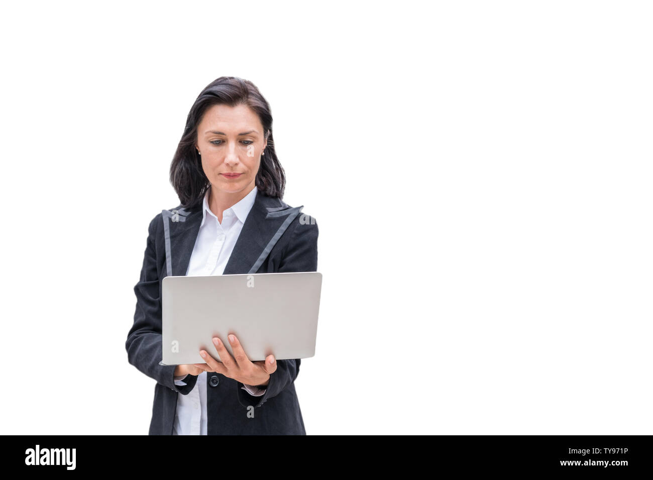 Woman engineer using laptop on white background Stock Photo