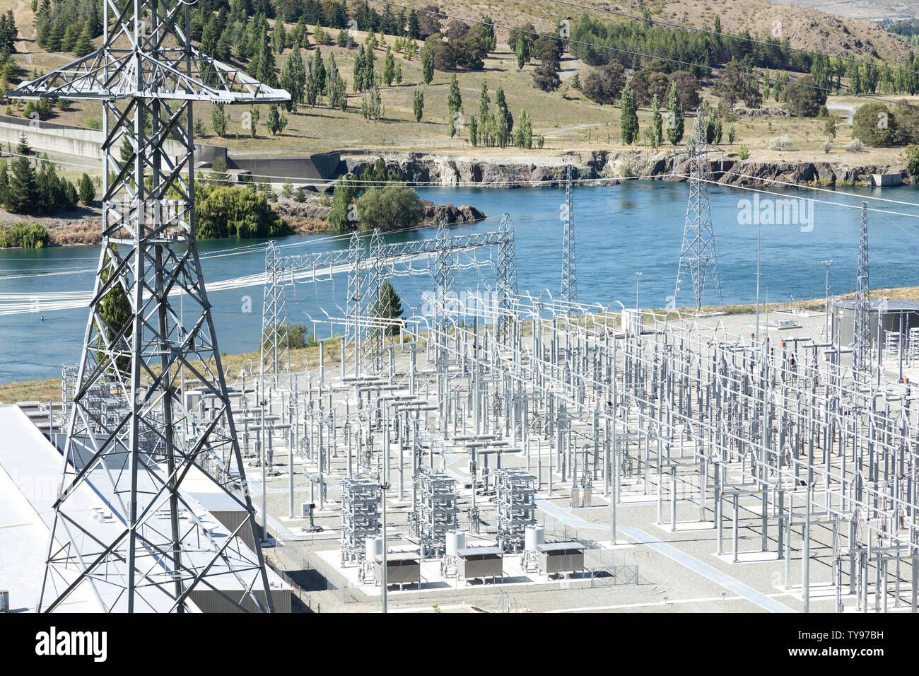 power transmission station near river in summer day Stock Photo Alamy