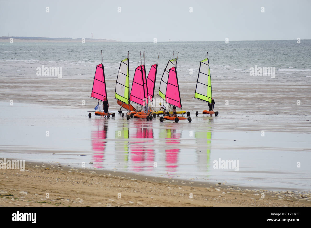 Mirror Reflection Of Colorful Sail Karts On The Beach In France Stock Mirror Reflection Of Colorful Sail Karts On The Beach In France Stock