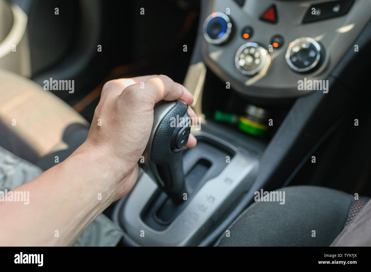 Driver male hand holding automatic gear shift in car Stock Photo Alamy