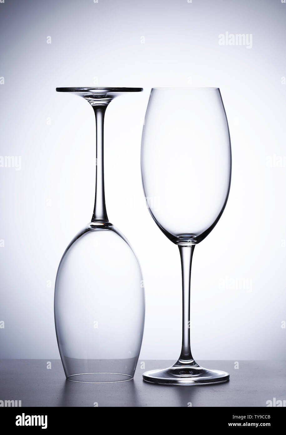 https://c8.alamy.com/comp/TY9CCB/empty-glass-of-red-wine-two-pieces-ones-upside-down-TY9CCB.jpg