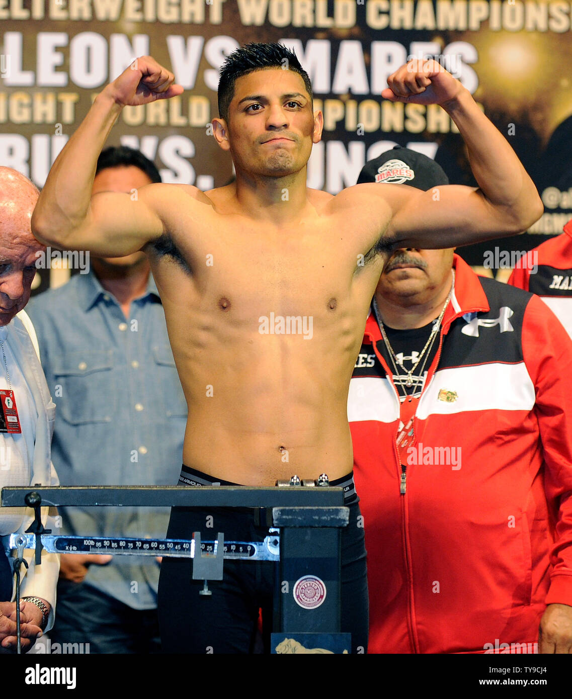 Boxer Abner Mares weighs in before his WBC Featherweight title fight