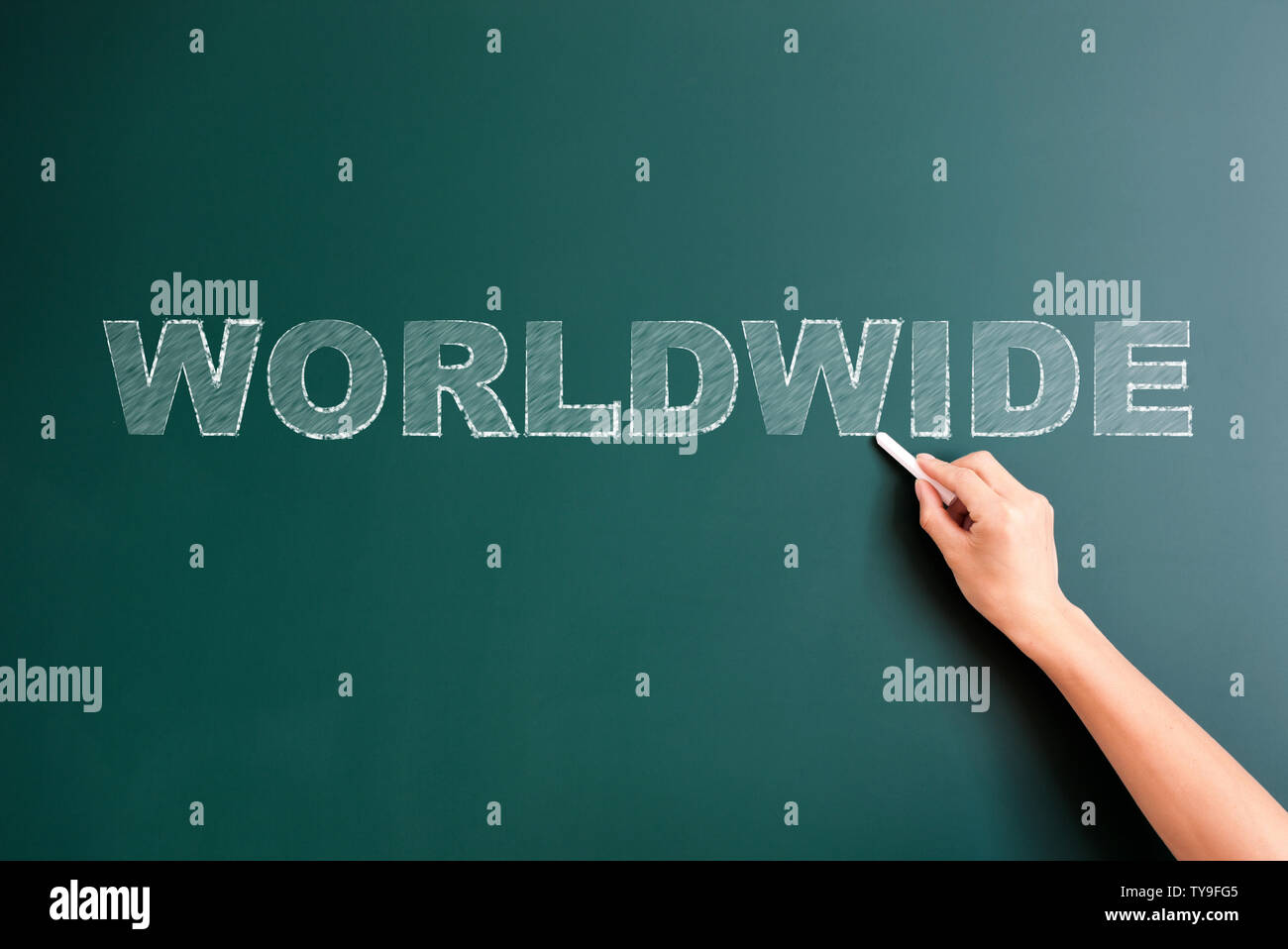 worldwide written on blackboard Stock Photo