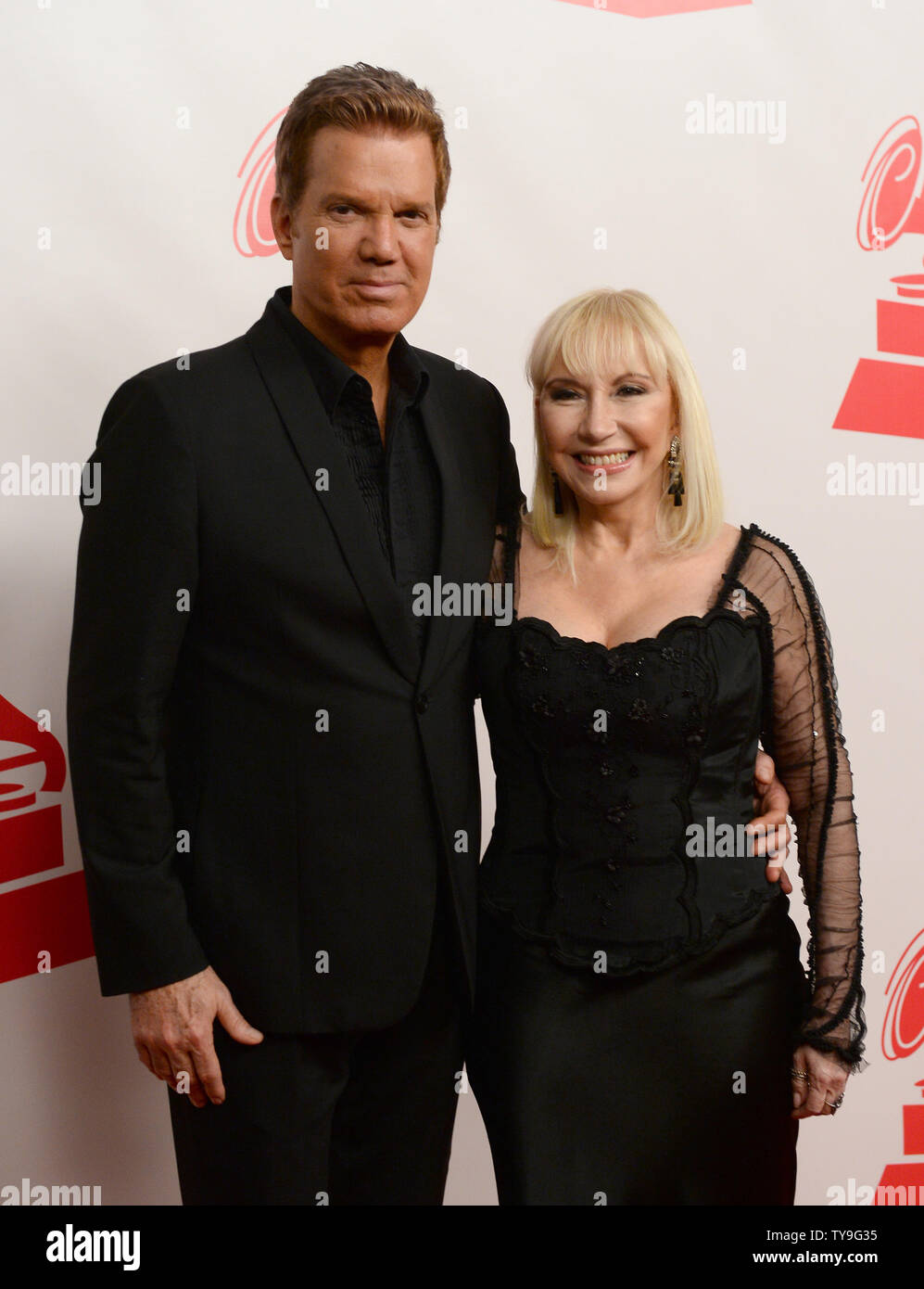 Willy Chirino, left, and Lissette arrive at the Latin Recording Academy Person of the Year tribute to Joan Manuel Serrat at the Mandalay Bay Events Center in Las Vegas, Nevada on November 19, 2014. UPI/Jim Ruymen Stock Photo