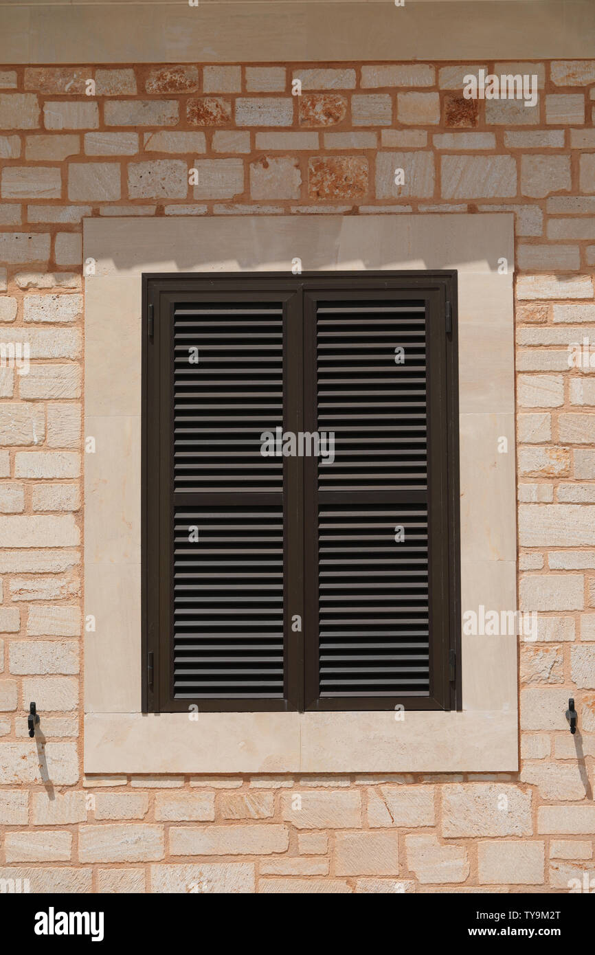 Window grilles folding shutters in Southern Europe Stock Photo Alamy