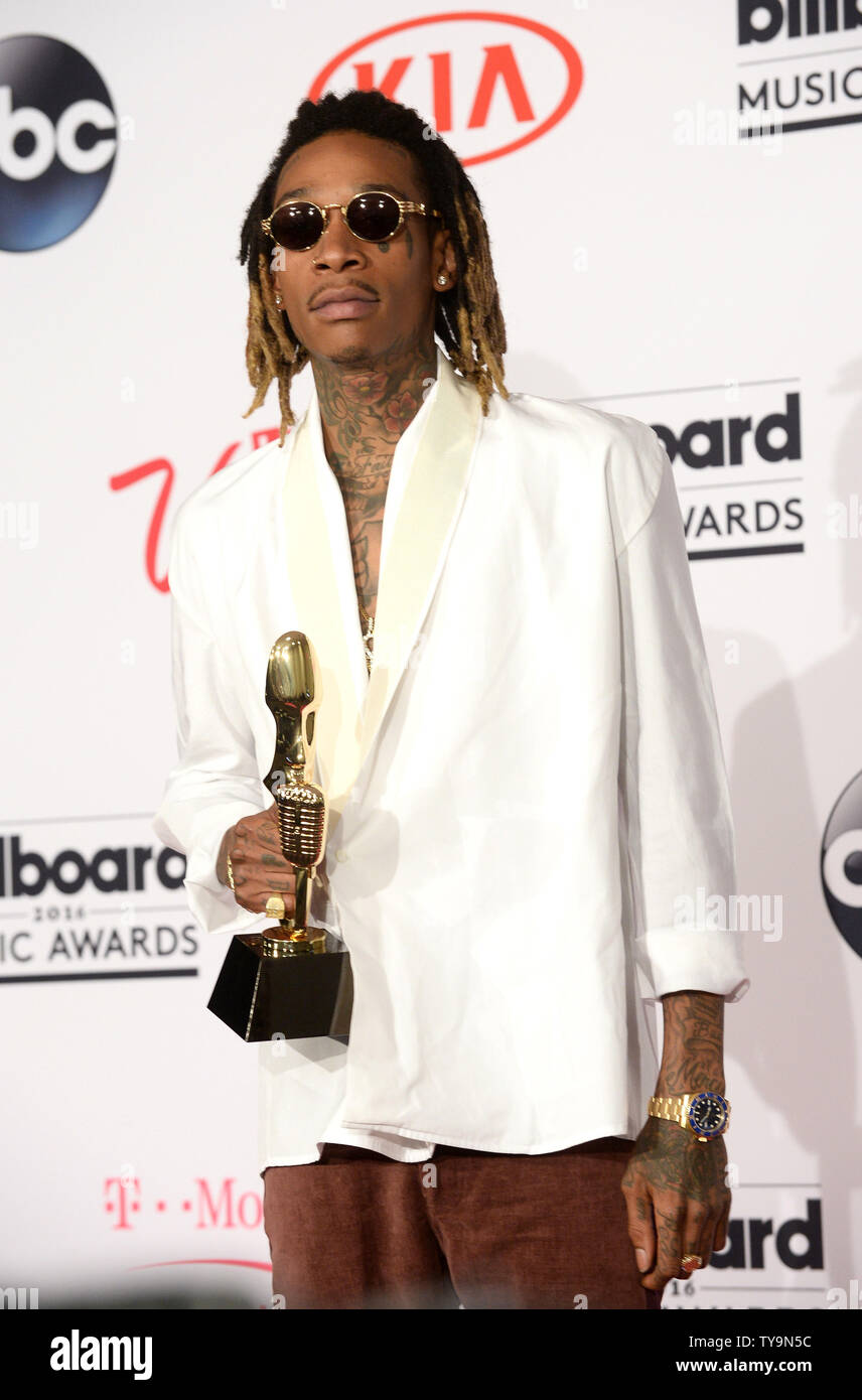 Singer Wiz Khalifa Appears Backstage With The Top Hot 100 Song Award For See You Again With Charlie Puth During The Annual Billboard Music Awards Held At T Mobile Arena In Las Vegas