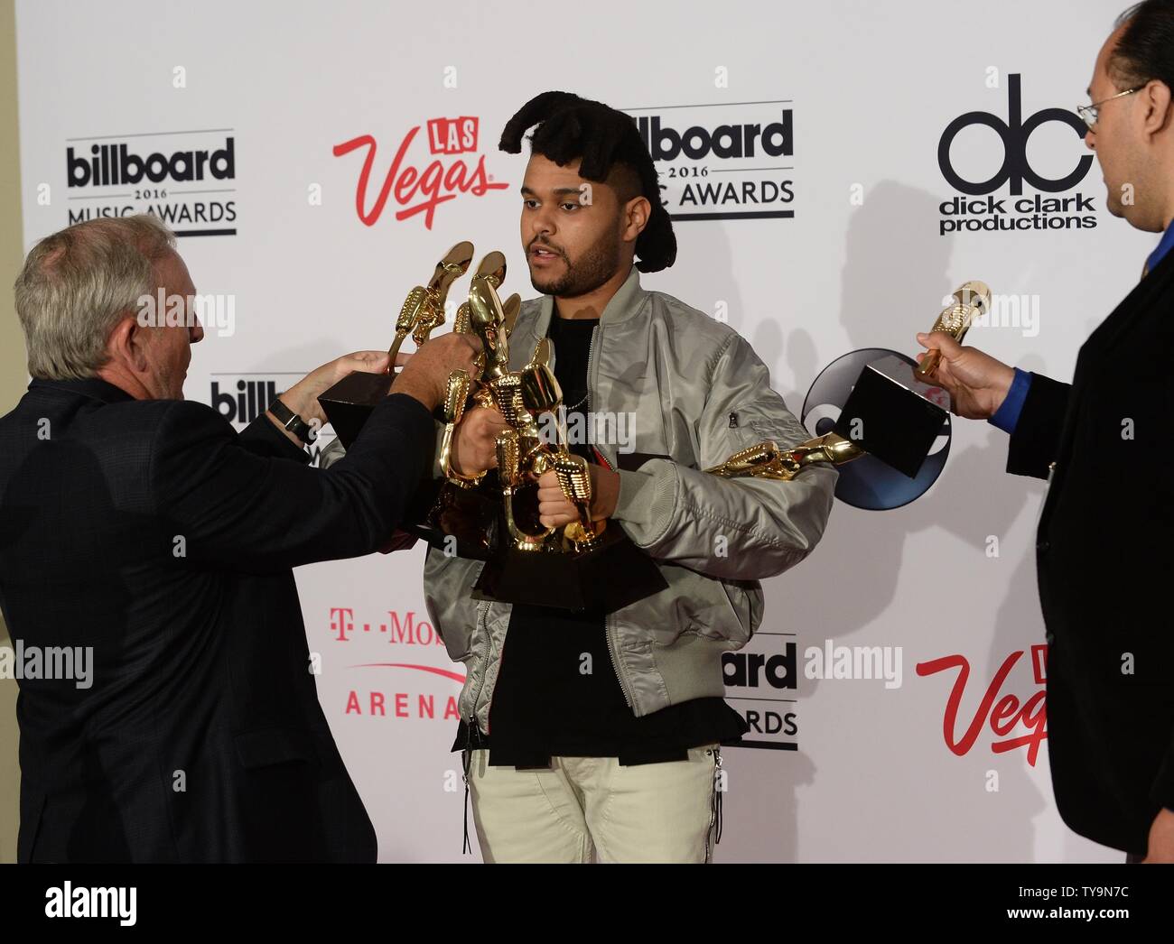 Singer The Weeknd appears backstage with his 8 Awards for Top Hot 100 Artist,  Top Song Sales Artist, Top Radio Songs Artist, Top Streaming Songs Artist,  Top R&B Artist, Top R&B Album,