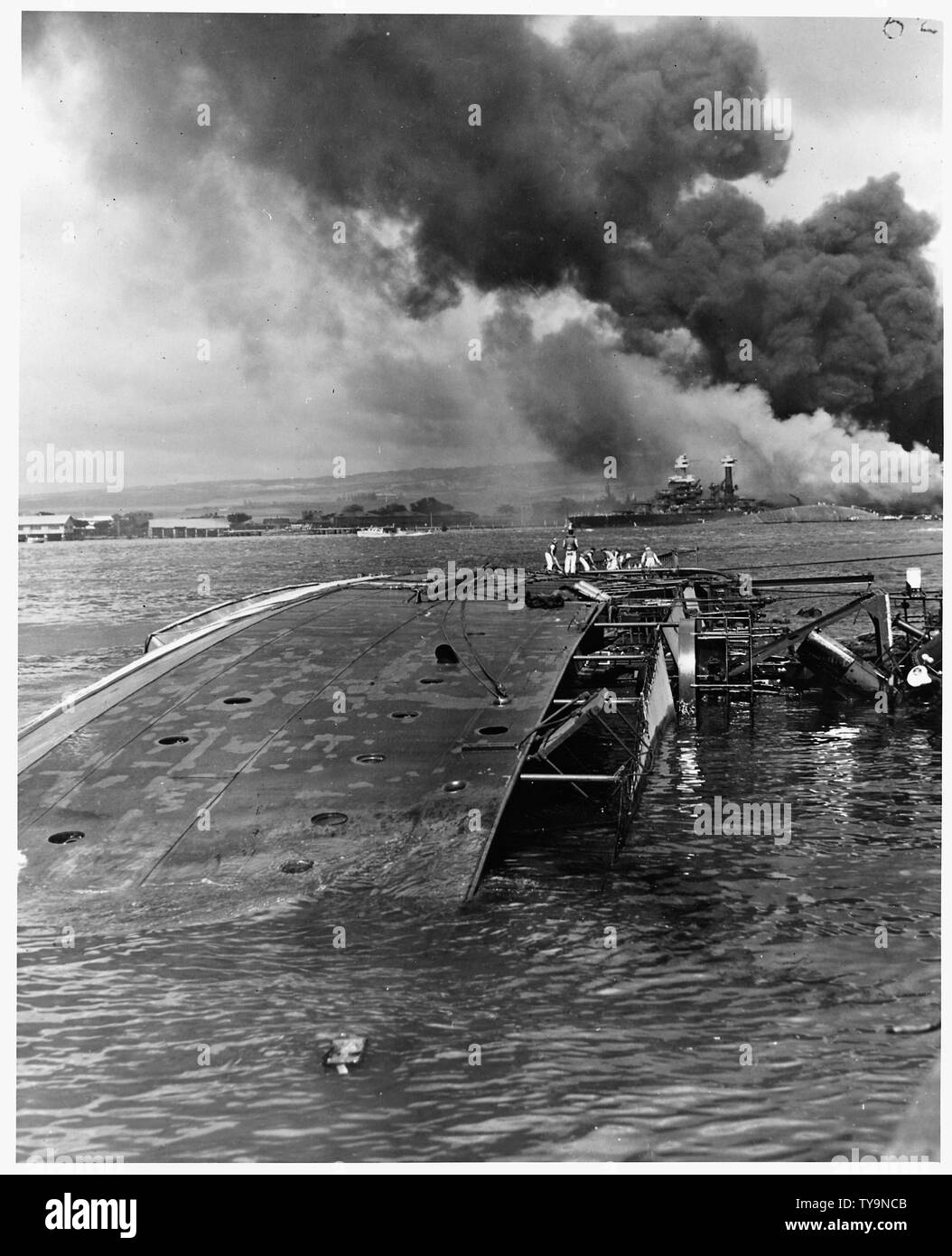 Naval photograph documenting the Japanese attack on Pearl Harbor, Hawaii which initiated US participation in World War II. Navy's caption: The USS OGLALA capsized after being attacked by Japanese aircraft and submarines in the attack on Pearl Harbor; Scope and content:  This photograph was originally taken by a Naval photographer immediately after the Japanese attack on Pearl Harbor, but came to be filed in a writ of application for habeas corpus case (number 298) tried in the US District Court, District of Hawaii in 1944. The case, In Re Lloyd C. Duncan related to imposition of martial law in Stock Photo