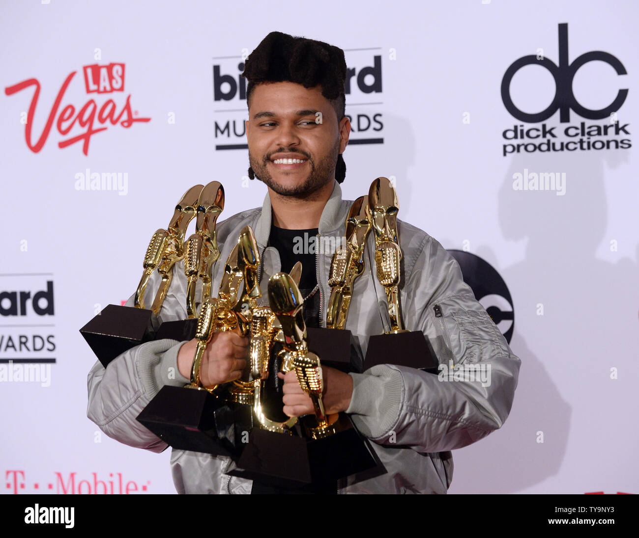 The Weeknd appears backstage with his eight awards during the annual  Billboard Music Awards held at T-Mobile Arena in Las Vegas on May 22, 2016.  The musician was honored as Top Hot