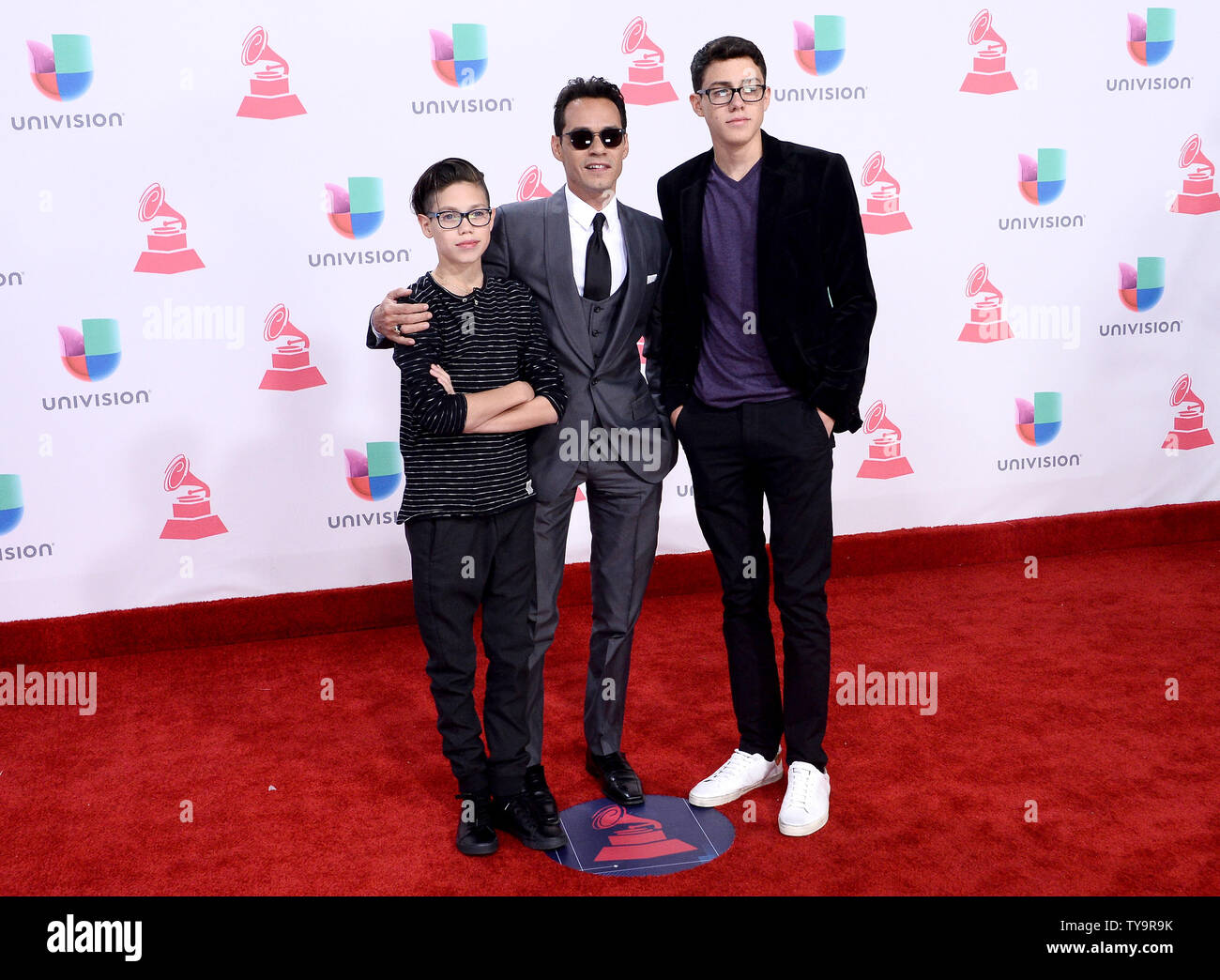 Ryan Adrian Muniz, recording artist Marc Anthony and Cristian Marcus