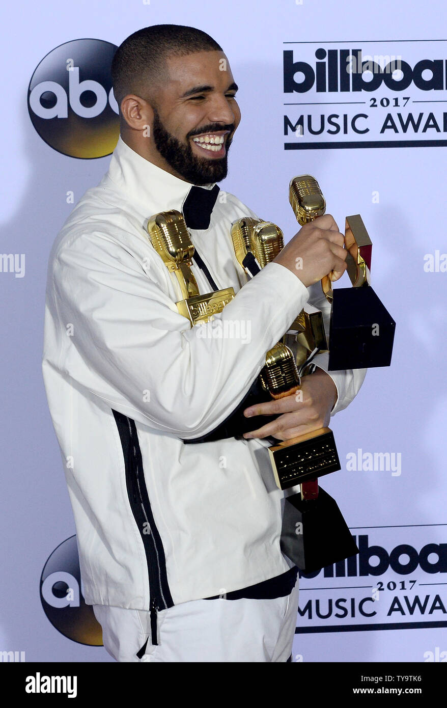Recording artist Drake appears backstage with his awards for Top Artist, Top  Male Artist, Top Billboard 200 Artist, Top Billboard 200 Album for 'Views,'  Top Hot 100 Artist, Top Song Sales Artist,