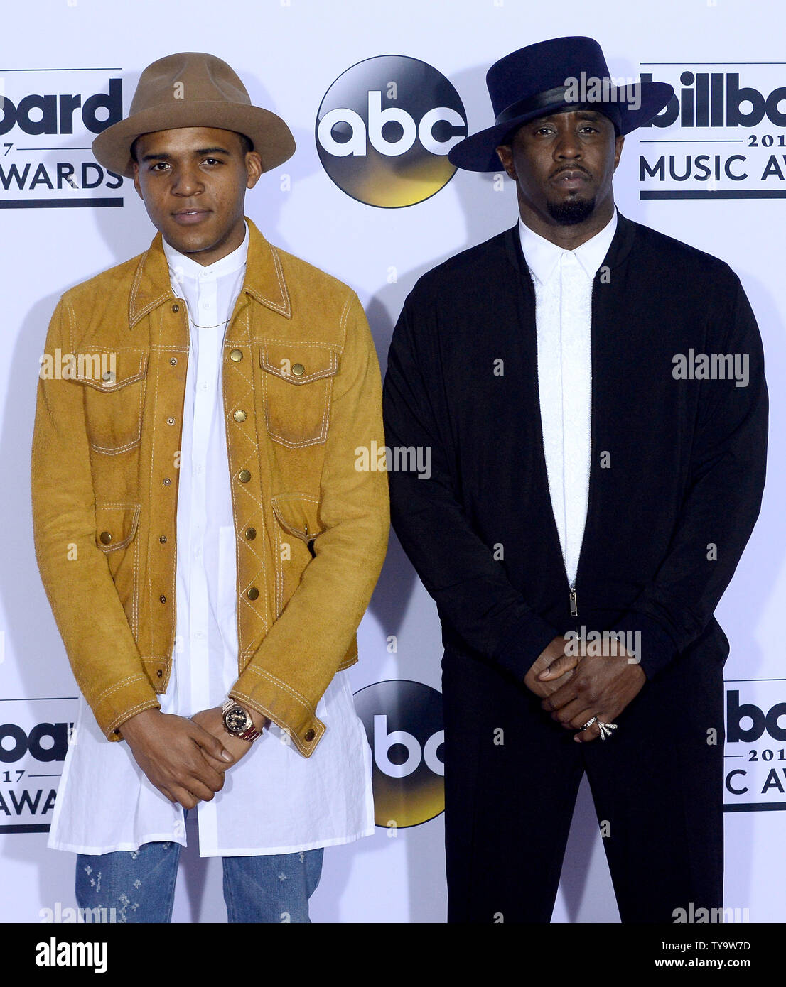 Actor Christopher Jordan Wallace (L) and producer Sean 'Diddy' Combs appear  backstage during the annual Billboard Music Awards held at T-Mobile Arena  in Las Vegas, Nevada on May 21, 2017. This year's