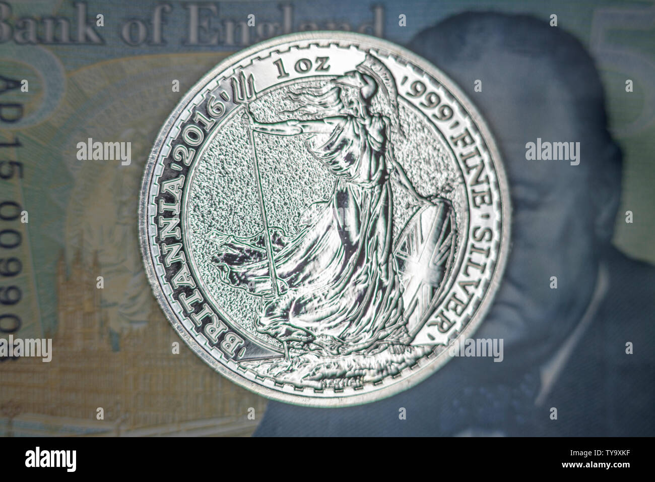Silver coin on banknote Stock Photo