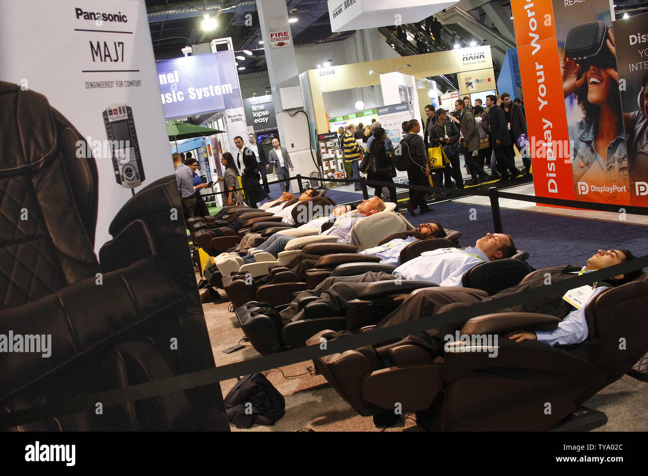 Some very relaxed attendees enjoying Panasonic's MAJ7 luxury massage chairs,  during the 2018 International CES, at the Las Vegas Convention Center in  Las Vegas, Nevada, January 9, 2018. Photo by James Atoa/UPI