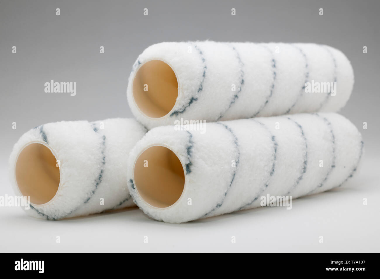 Three striped paint rollers Stock Photo