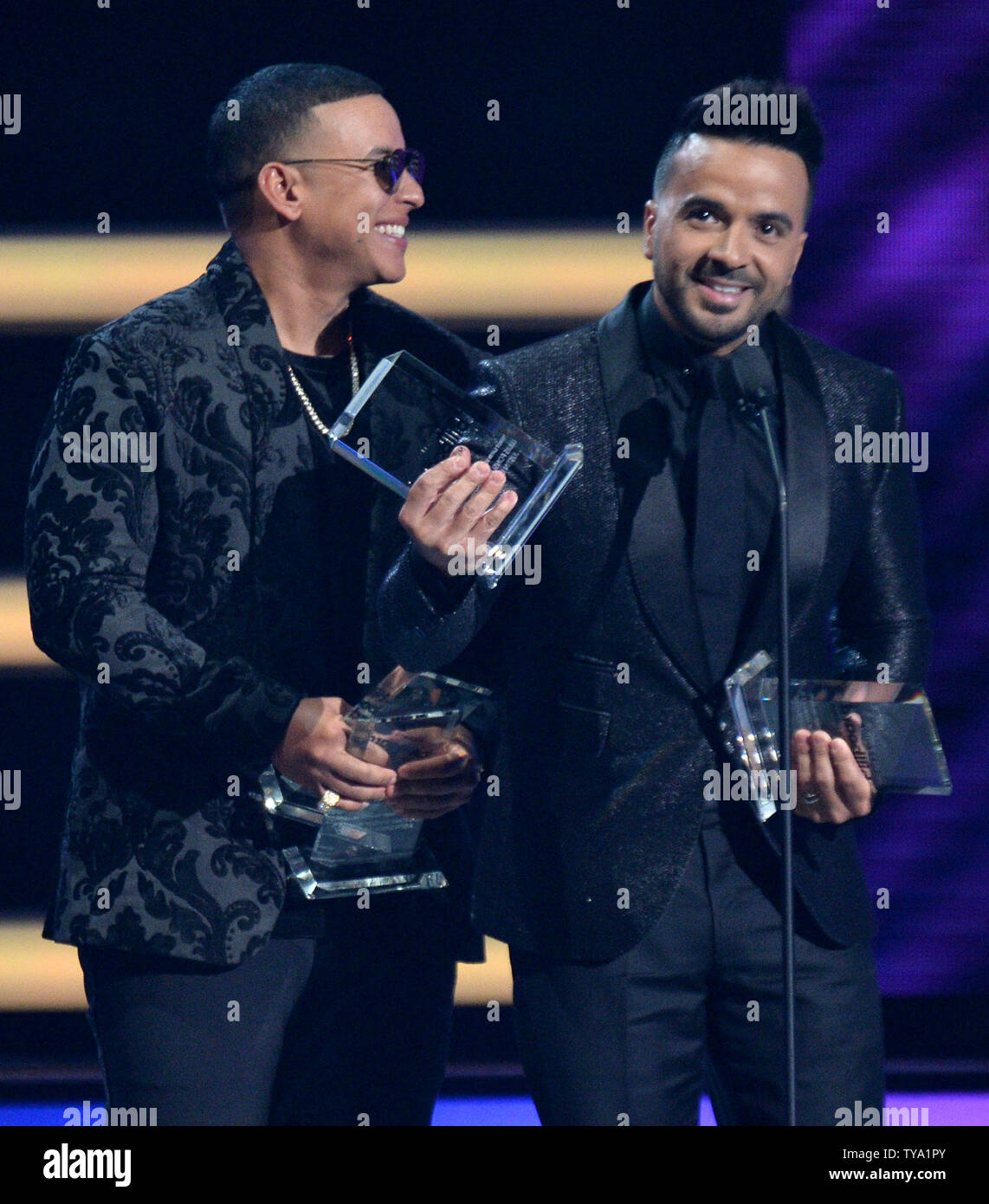 L-R) Daddy Yankee and Luis Fonsi accept the award for Latin Pop Song of the  Year for "Despacito" onstage during the 2018 Billboard Latin Music Awards  at the Mandalay Bay Events Center