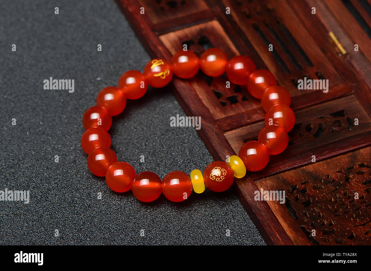 Red crystal agate, eight patron guardians bracelets. Stock Photo