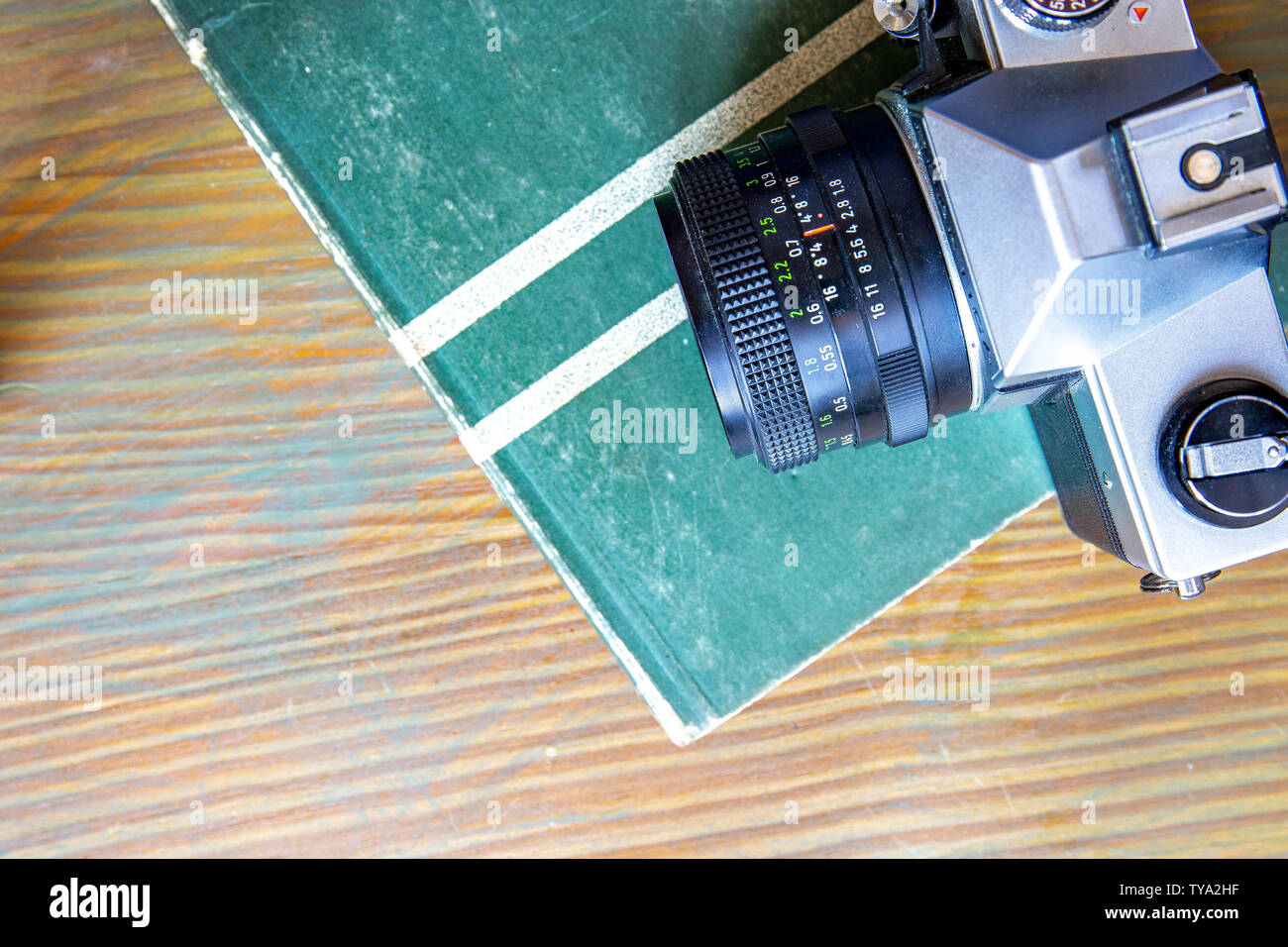 Analog Camera on Table with Book Stock Photo Alamy