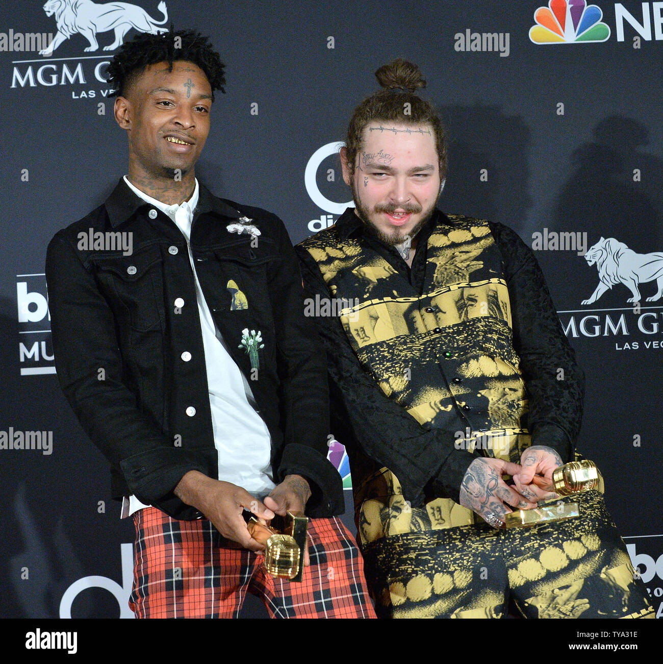 Recording artists 21 Savage (L) and Post Malone appear backstage after  winning the top Rap Song award for 'Rockstar,'' during the 2018 Billboard  Music Awards at MGM Grand Garden Arena on May