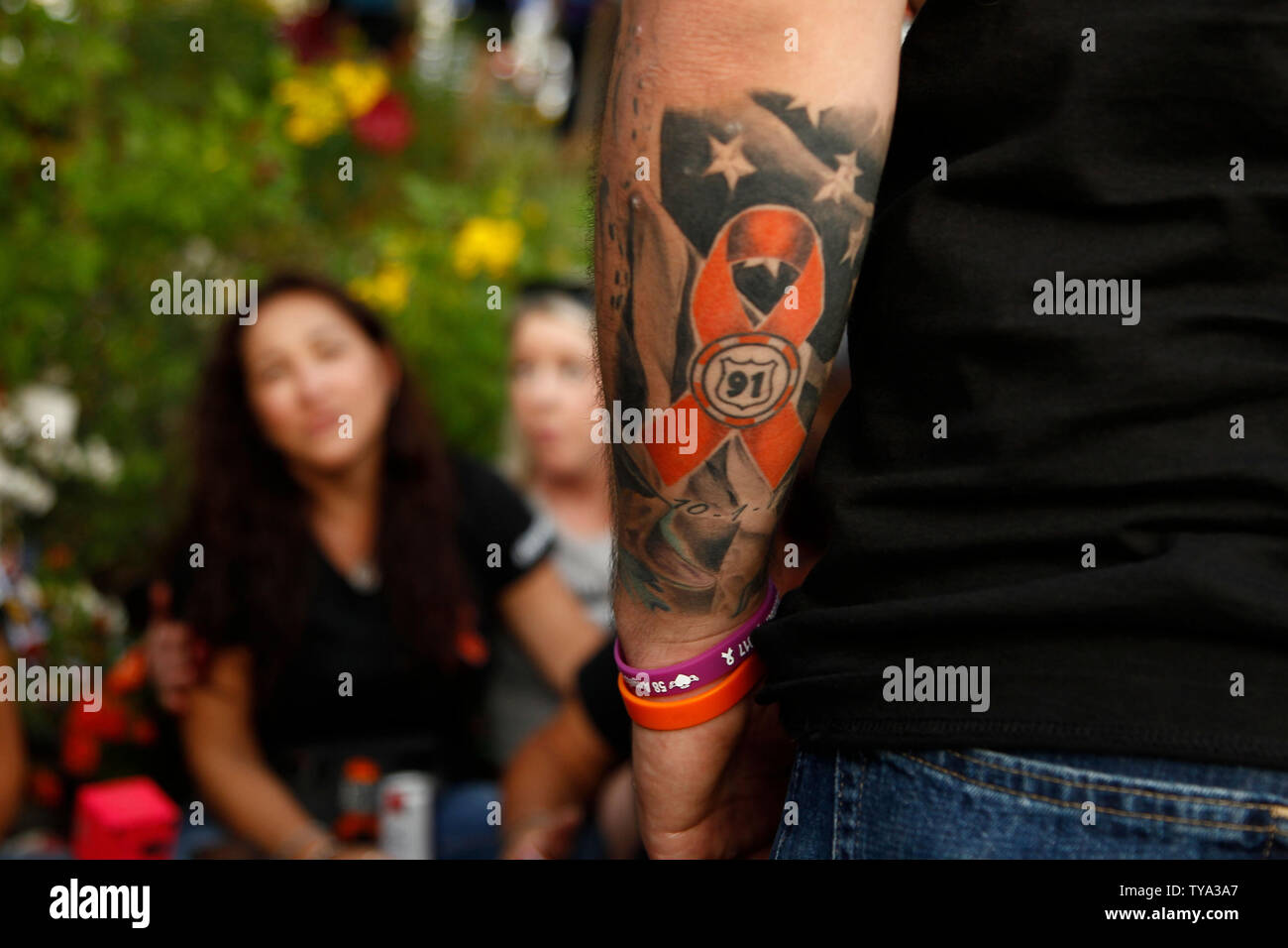 A view of a colorful Route 91 tattoo on the arm of a relative of Navy  veteran Christopher Roybal who was killed during the Route 91 mass  shooting seen at the Healing