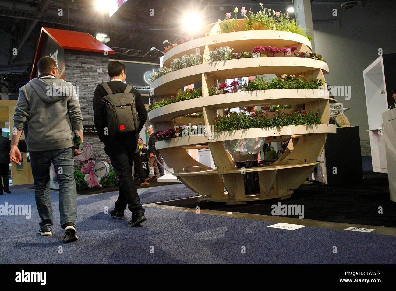 Two attendees walk past a large sphere shaped Aquaponics garden on display during the 2019 International CES, at the Sands Convention Center in Las Vegas, Nevada, January 8, 2019. Photo by James Atoa/UPI Stock Photo