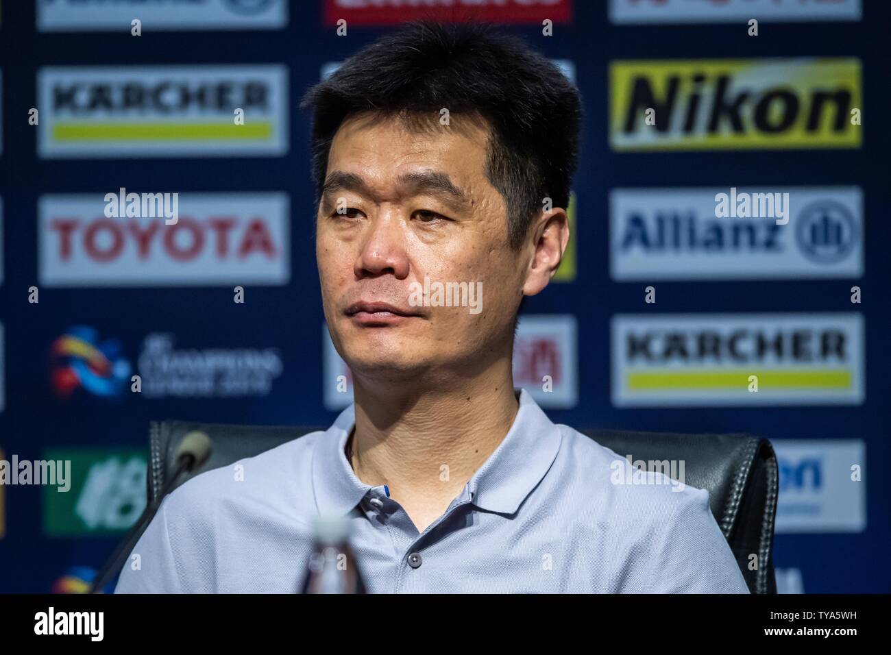 Head coach Li Xiaopeng of China's Shandong Luneng Taishan F.C. attends a press conference after the eighth-final match against China's Guangzhou Evergrande Taobao F.C. during the 2019 AFC Champions League in Ji'nan city, east China's Shandong province, 25 June 2019. Stock Photo