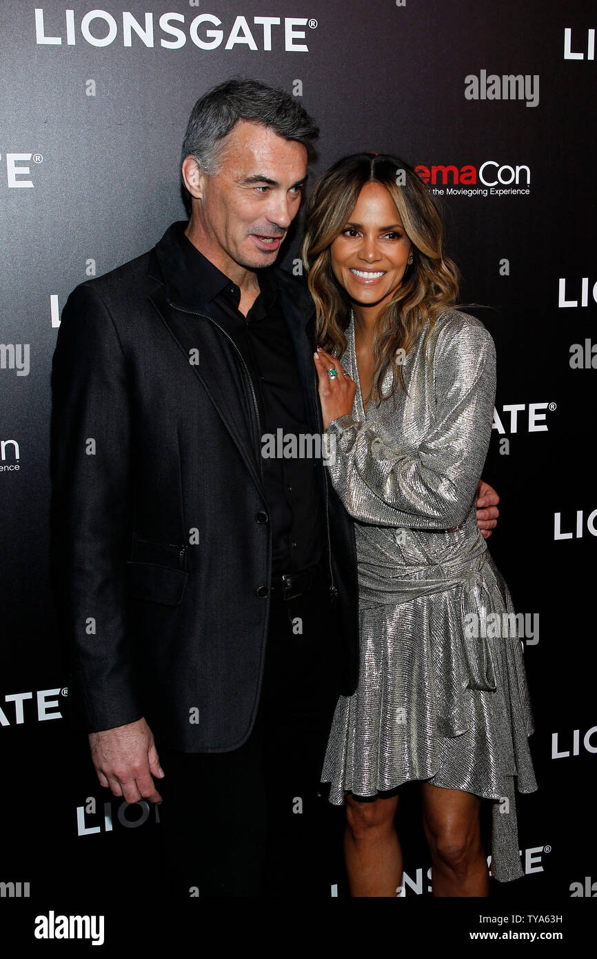 Director Chad Stahelski and actress Halle Berry arrive for the