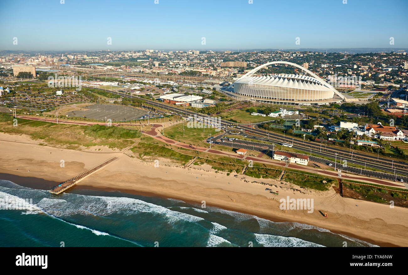 Drone aerial view of Moses Mabhida Stadium and beach shoreline in Durban. Kwazulu Natal, South Africa. Full colour horizontal image. Stock Photo