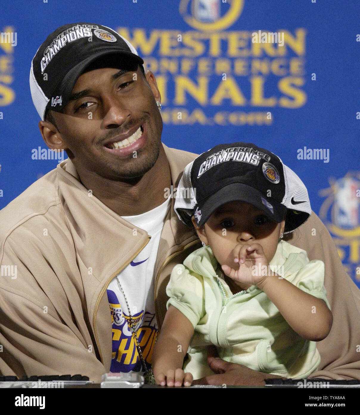 Los Angeles Lakers guard Kobe Bryant holds his daughter Natalia