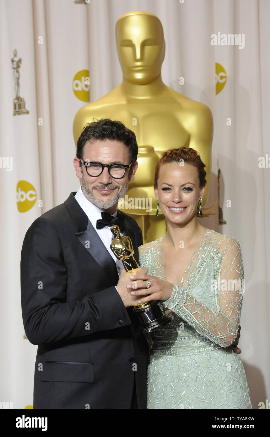 Michel Hazanavicius winner of Achievement in Directing for 'The Artist' poses with Berenice Bejo backstage at the 84th Academy Awards in the Hollywood section of Los Angeles on February 26, 2012. 'The Artist' won five Oscars including Best Picture. UPI/Phil McCarten Stock Photo