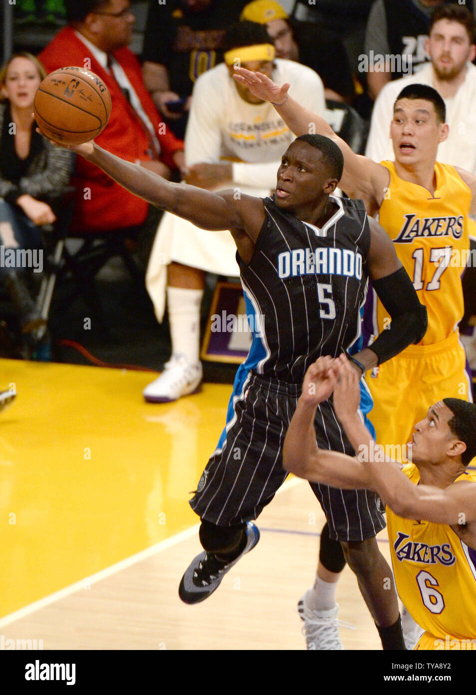 Orlando Magic guard Victor Oladipo(5) scores past Los Angeles Lakers guard Jeremy Lin (17) during the first half of their NBA game at Staples Center in Los Angeles, January 9, 2015. The Lakers beat the Magic 101-84.   UPI/Jon SooHoo Stock Photo