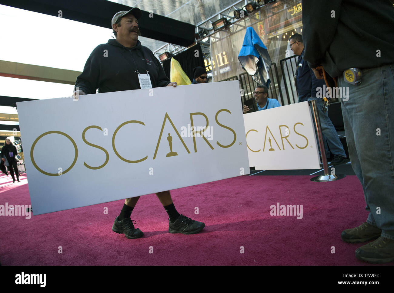 Workers install Oscars signage on the red carpet as preparations are underway for the 89th annual Academy Awards in the Hollywood section of Los Angeles on February 24, 2017. The 2017 Academy Awards will take place this Sunday, February 25. Photo by Kevin Dietsch/UPI Stock Photo