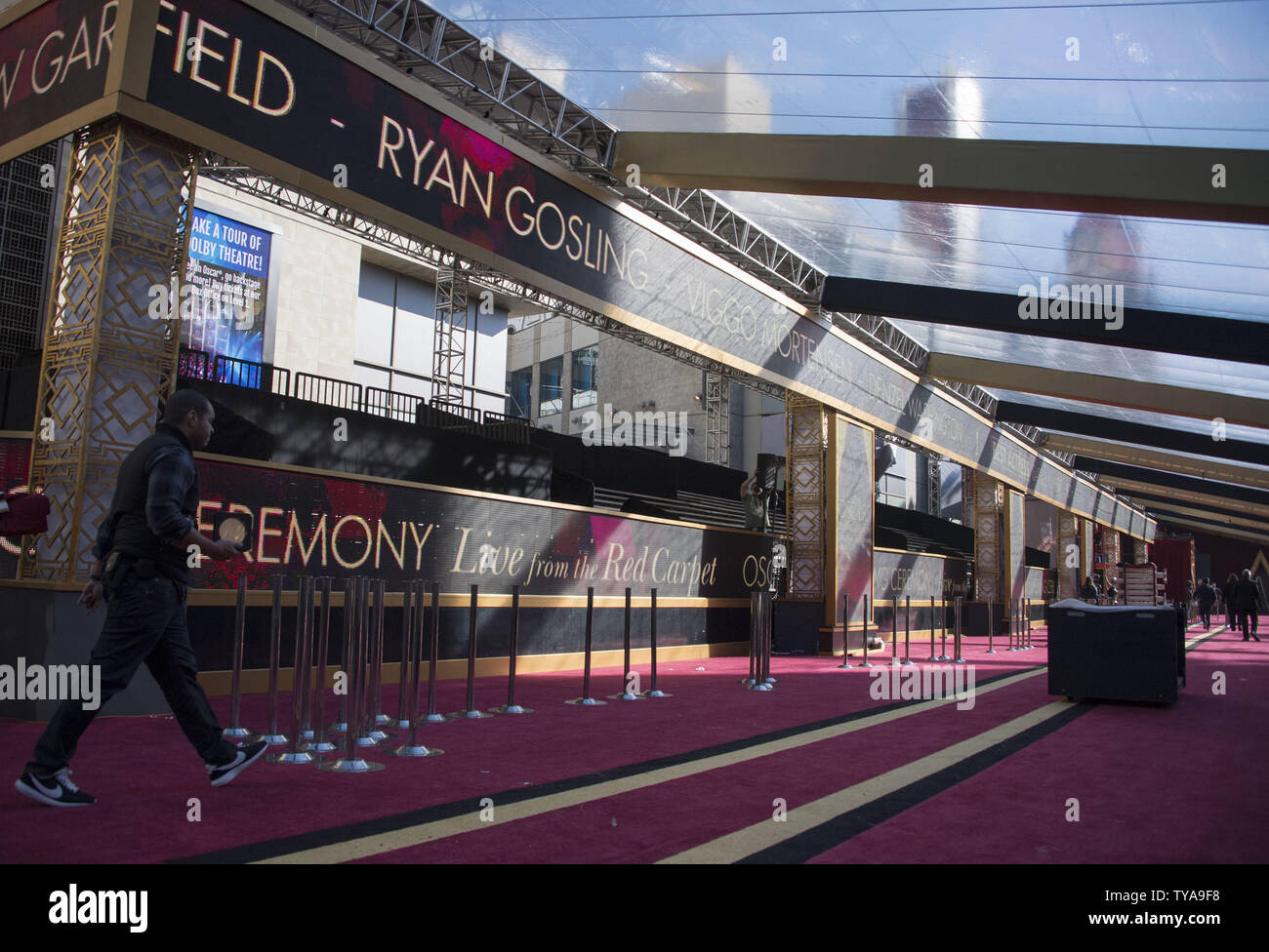 A man walks on the red carpet as preparations are underway for the 89th annual Academy Awards in the Hollywood section of Los Angeles on February 24, 2017. The 2017 Academy Awards will take place this Sunday, February 25. Photo by Kevin Dietsch/UPI Stock Photo