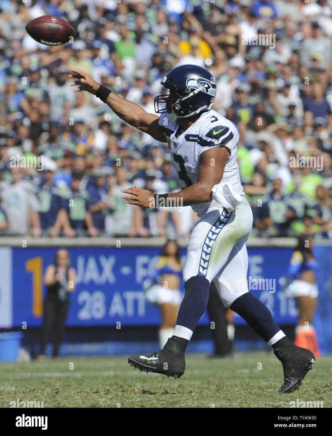 Seattle Seahawks Vs. Los Angeles Rams. Fans Support On NFL Game. Silhouette  Of Supporters, Big Screen With Two Rivals In Background. Stock Photo,  Picture And Royalty Free Image. Image 151158439.