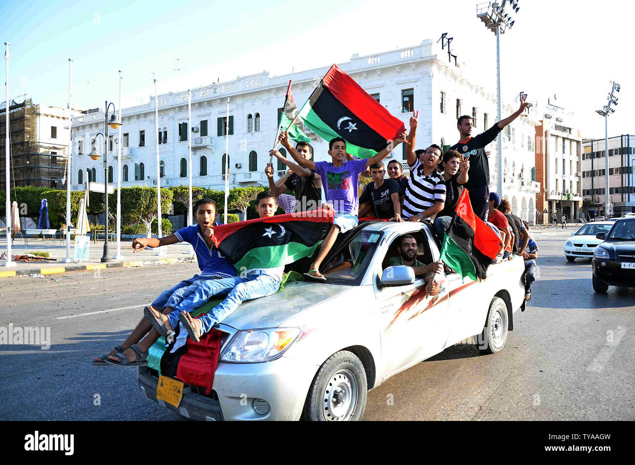 Libyans celebrate as people tour the inside of Baba al Azizia, Moammar Gaddafi's main military compound on August 26, 2011 in Tripoli, Libya. The main compound has turned into a tourist attraction and a symbol of Gaddafi's ousted regime. Numbers of Libyans are gathering to celebrate his downfall and to tour the compound which up until August 23, 2011 has been hidden from public view until the recent surge into Tripoli by rebel forces. UPI Tarek Elframawy. Stock Photo