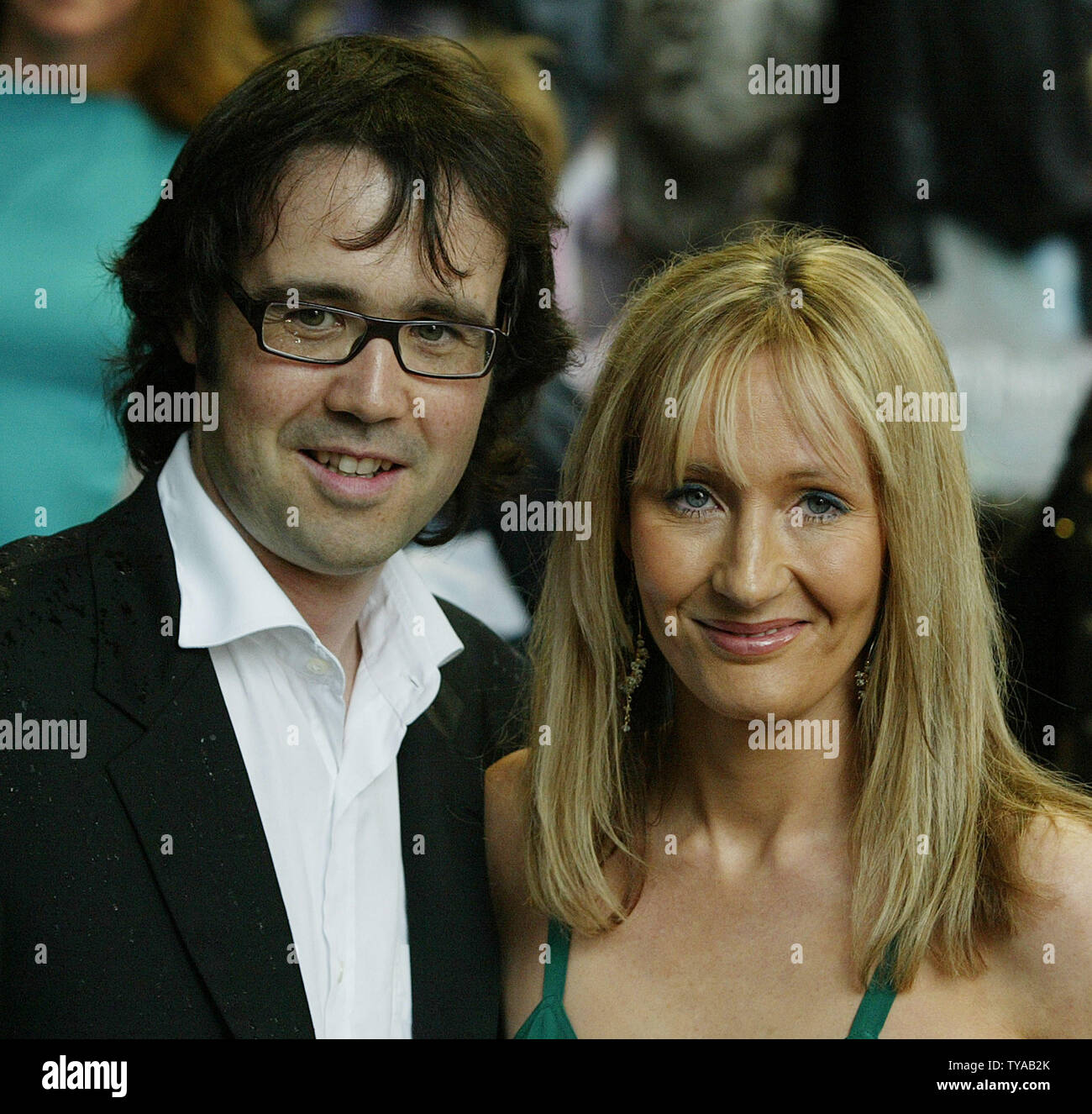Author of the Harry Potter books J.K.Rowling (R) poses with her husband ...