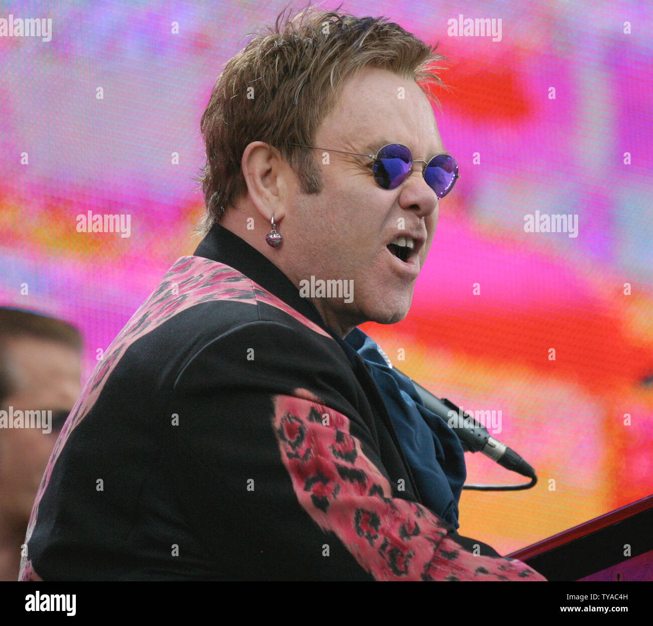 Singer Elton John performs during the Live 8 Concert in Hyde Park in London, England July 2, 2005.  The concert, held simultaneously in many cities around the world including Paris, Berlin, Philadelphia and Rome, is intended to call attention to world poverty ahead of next week's G8 meeting in Scotland.      (UPI Photo/David Silpa) Stock Photo