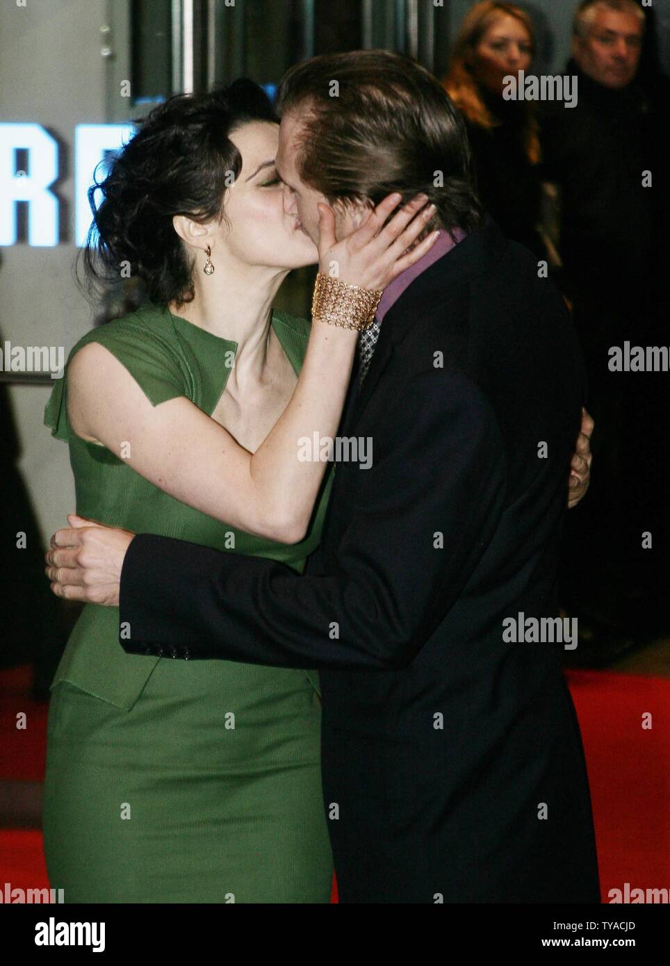 British actress Rachel Weisz (L) kisses her co-star Ralph Fiennes at the  opening of their new film "The Constant Gardener" which launched the London  Film festival 2005 in London on October 19