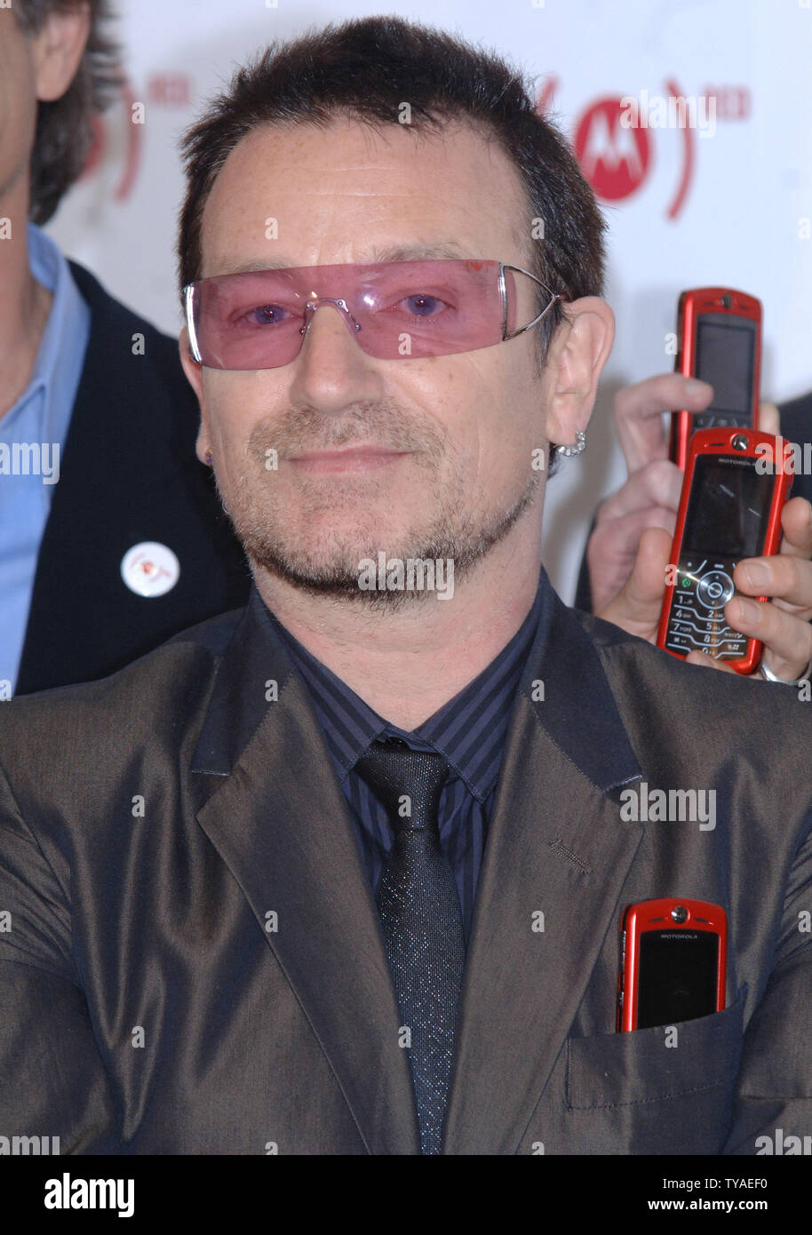 Bono,the lead singer of Irish group U2, attends a photocall for Product Red 's new Motoslvr phone which is created to help eliminate AIDS in Africa at Carphone Warehouse in London on May 15,2006. (UPI Photo/Rune Hellestad) Stock Photo