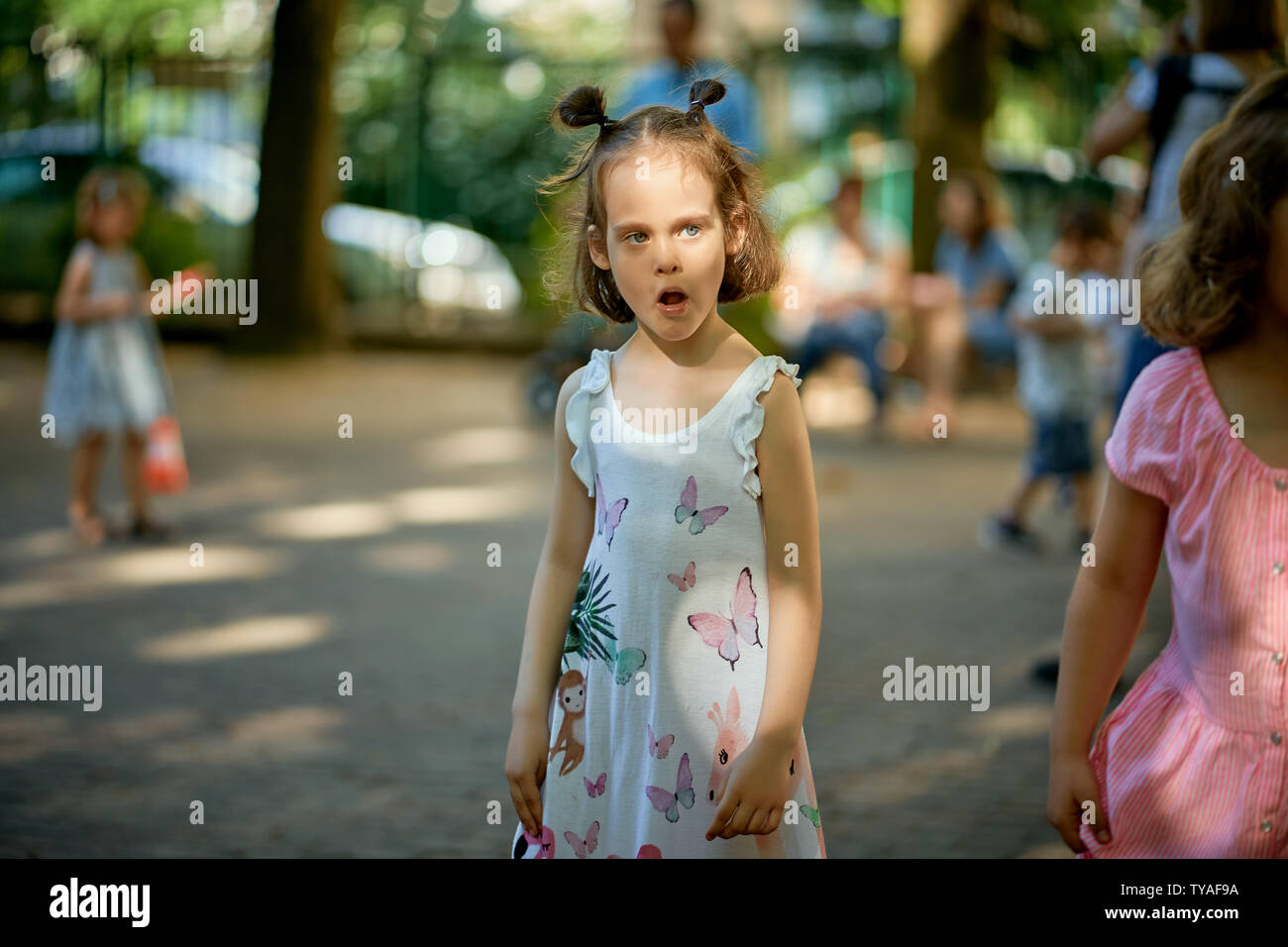Portrait of cute little girl at playground on summer day Stock Photo ...