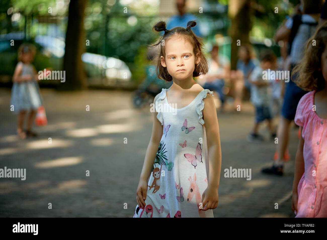 Portrait of cute little girl at playground on summer day Stock Photo ...