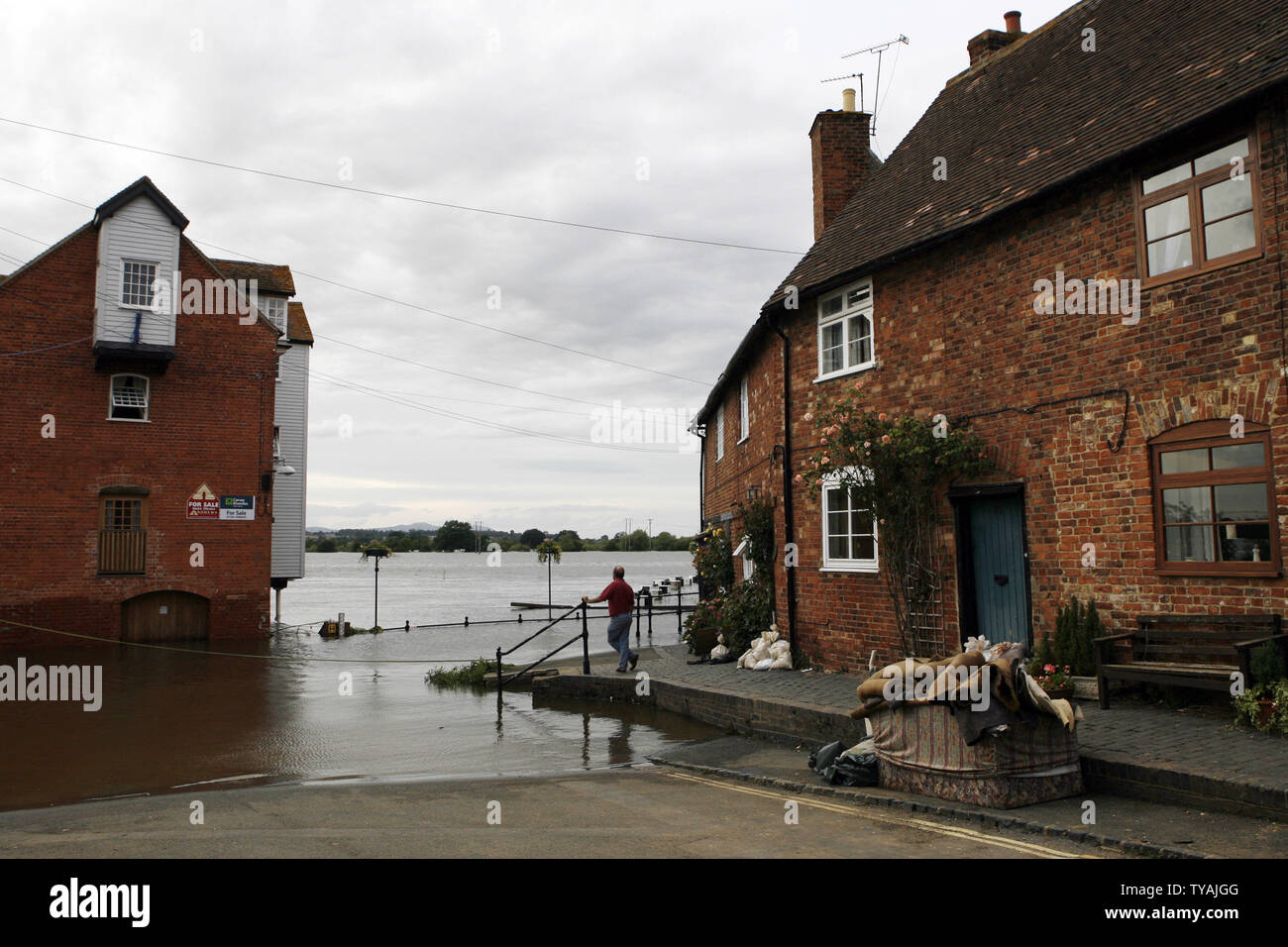 A resident of the village of Tewkesbury in Gloucester looks into the fields that are underwater after recent heavy flooding in England on July 25, 2007. The village is getting slowly back to normal as the water recedes, but residents are expected to have no fresh drinking waters for up to two weeks. (UPI Photo/Hugo Philpott) Stock Photo