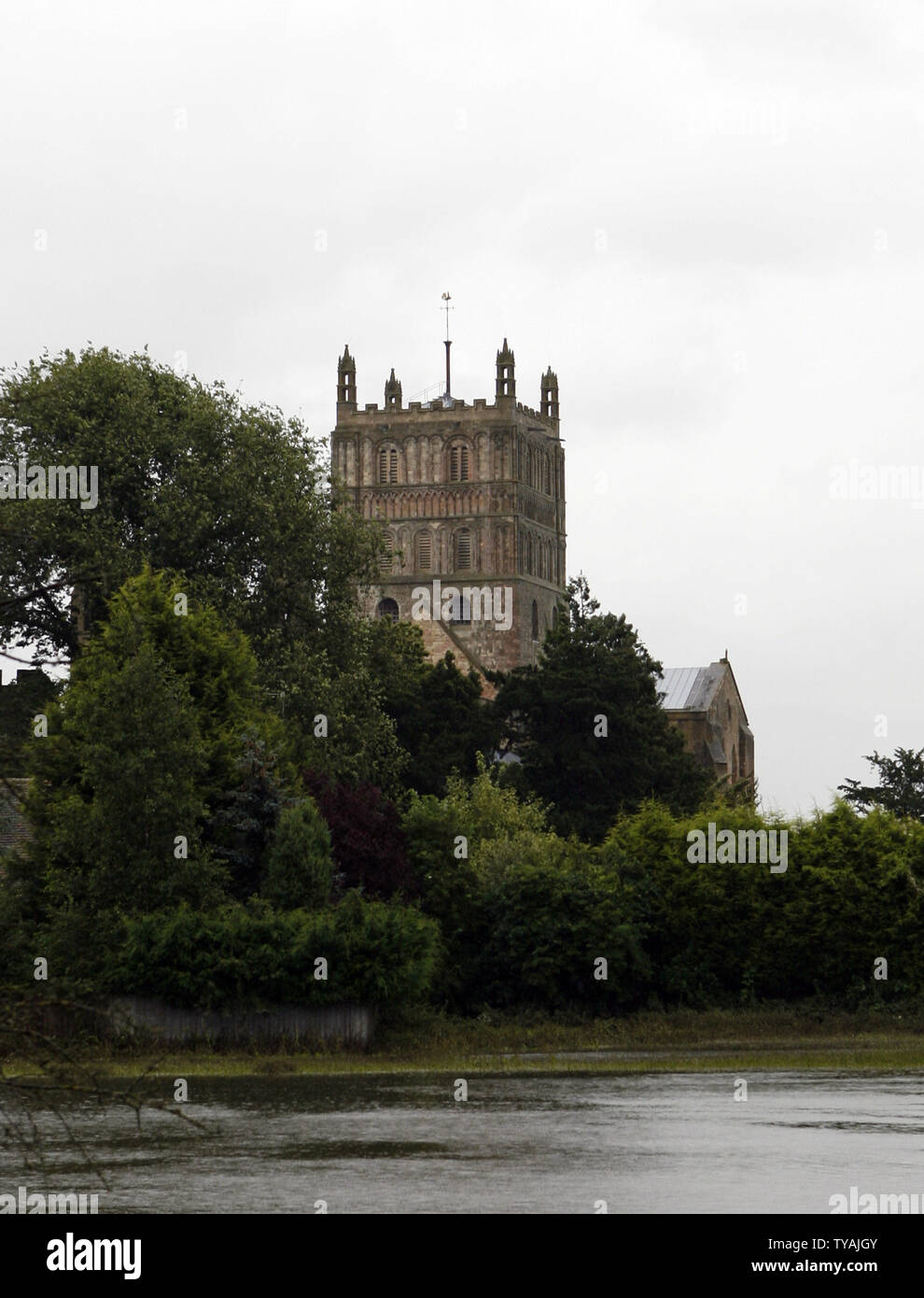 The Abbey of Tewkesbury is surrounded by flood water after recent heavy flooding in England on July 26, 2007. The village has been getting slowly back to normal but heavy rain continues to threaten the residents. (UPI Photo/Hugo Philpott) Stock Photo