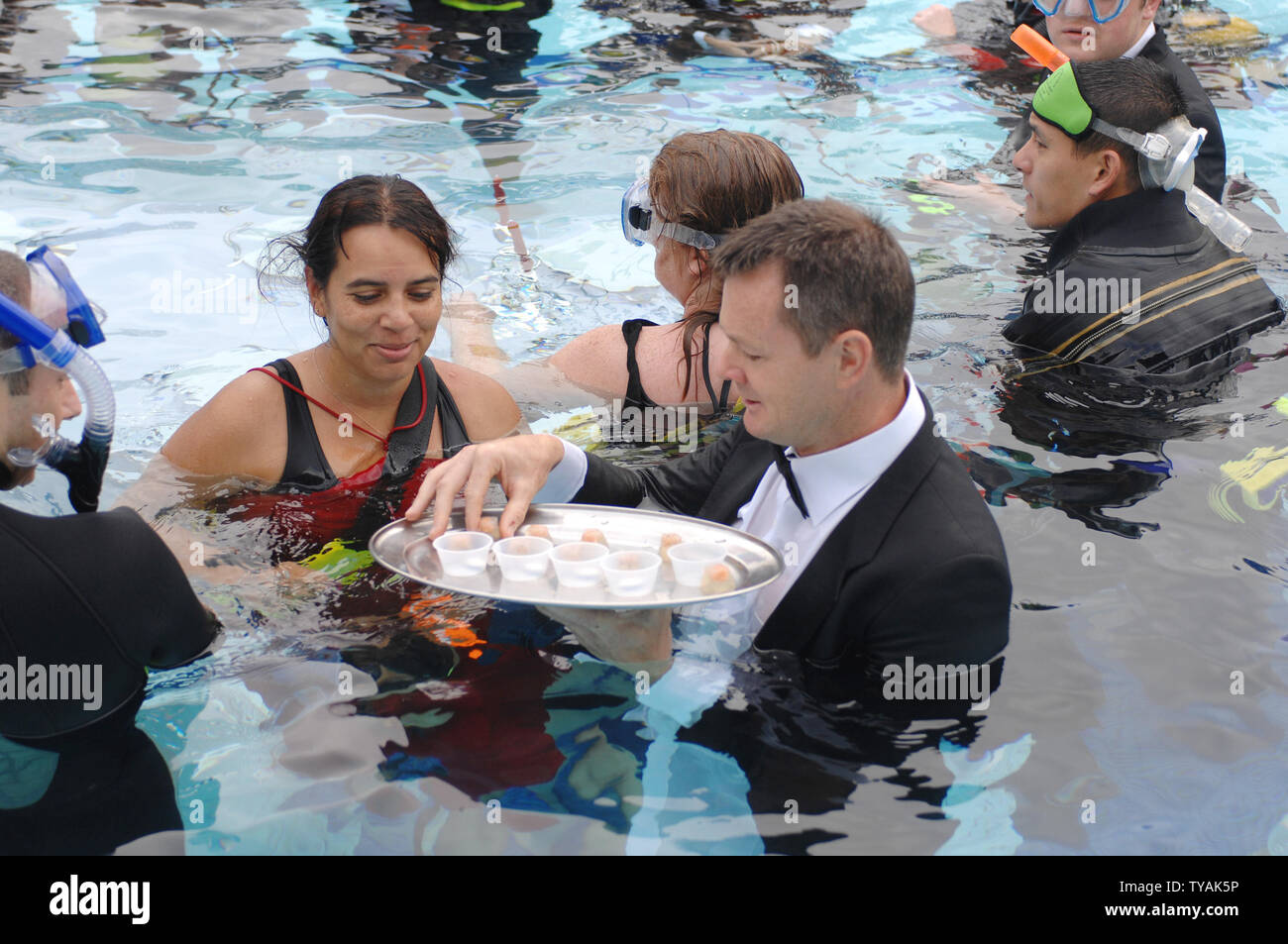 Guests attend "The World's Largest Formal Underwater Dinner Party", a  Guinness world record breaking attempt for charity at The Park Club in  London on September 22, 2007. (UPI Photo/Rune Hellestad Stock Photo -