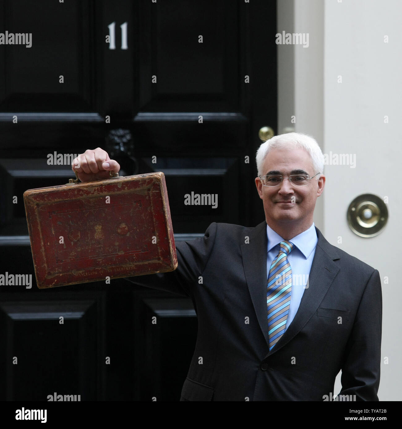 Britain's Chancellor of the Exchequer Alastair Darling holds Disraeli's original budget box outside number 11 Downing St in London on April 22 2009 in London.The Chancellor is expected to reveal the depth of the UK recession to parliamentary colleagues this afternoon. (UPI Photo/Hugo Philpott) Stock Photo