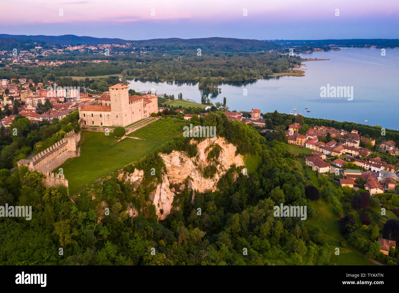 View of the fortress called Rocca di Angera during a spring sunset. Angera, Lake Maggiore, Varese district, Lombardy, Italy. Stock Photo